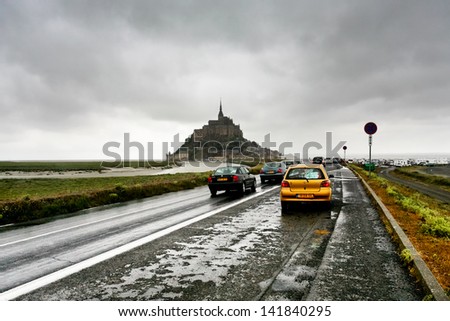 MONT SAINT-MICHEL, FRANCE - JULY 5:road to Mont Saint-Michel in France on July 5,2010. It was used in 6-7th centuries as Armorican stronghold and first monastic building was established in 8th century