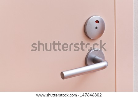 closed pink inner door with metallic handle