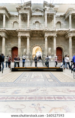 BERLIN, GERMANY - OCTOBER 16: tourist in Market gate of Miletus Hall of Pergamon museum in Berlin on October 16, 2013. Museum the most visited in Berlin it hosts more than 1.5million visitors per year
