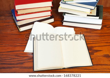two open books on wooden table