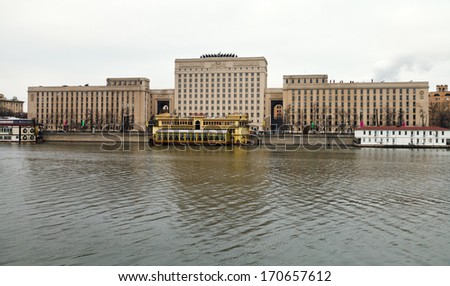 MOSCOW, RUSSIA - JANUARY 2, 2014: view of floating restaurants on Moskva River and Building of General Staff Russian land forces (built 1940-1951, architect Rudnev) on Frunze (Frunzenskaya) embankment