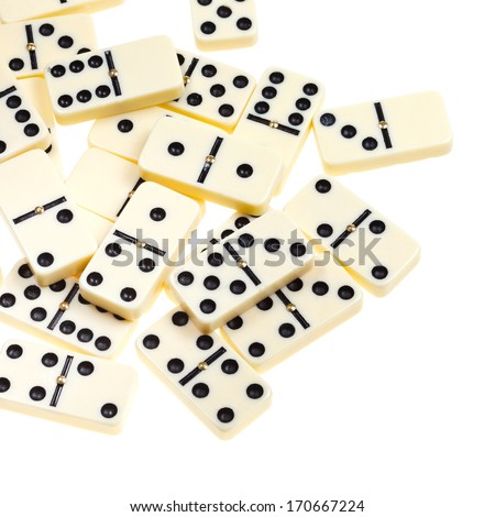 above view of many scattered dominoes isolated on white background
