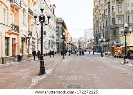 MOSCOW, RUSSIA - JANUARY 19, 2014: tourists walk on Arbat street in Moscow. Arbat has existed since the 15th century, it is pedestrian street about one km long in historical centre of Moscow