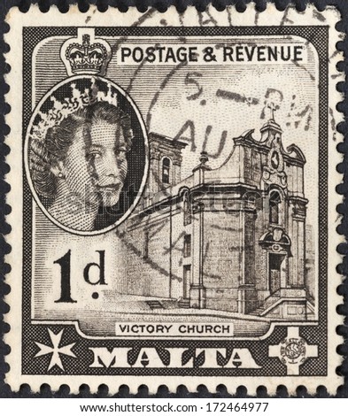 MALTA - CIRCA 1956: A stamp printed in Malta shows Queen Elizabeth II and medieval Victory Church in Valleta, circa 1956