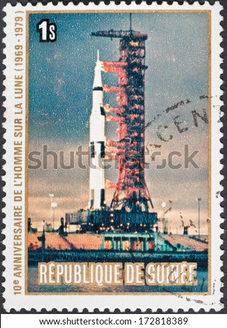 REPUBLIC OF GUINEA - CIRCA 1979: A postage stamp printed in the Republic of Guinea shows the Apollo 11 Moon Landing and first step on The Moon surface - launch of spacecraft, circa 1979