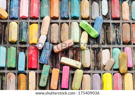 pack of many used artistic dry pastels close up