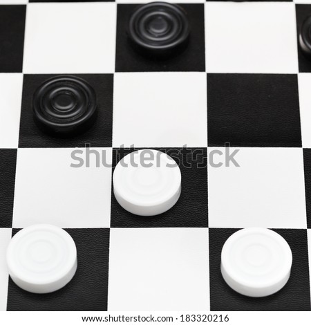 checkers game on black and white board