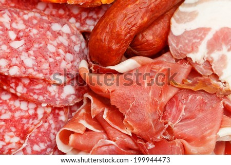 assorted sliced meat delicacies on plate close up