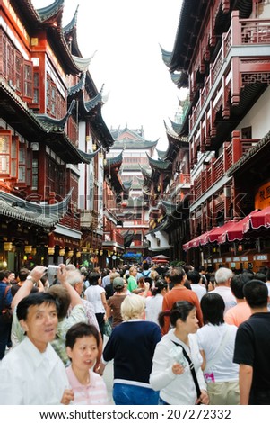 SHANGHAI, CHINA - JUNE 3, 2007: many tourist on Old Street in Old City of Shanghai, China. Old City of Shanghai , also formerly known as the Chinese city, is the traditional urban core of Shanghai.