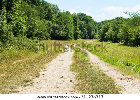country road in low caucasus mountains in summer day