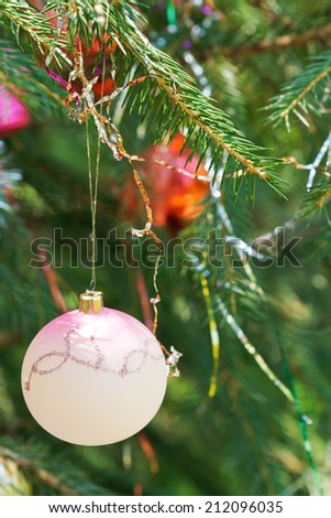 pink ball and red balls christmas tree vintage decoration close up