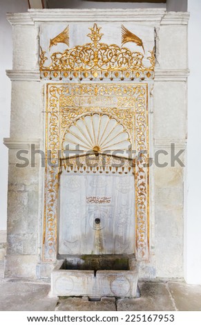 BAKHCHYSARAI, RUSSIA - OCTOBER 1, 2014: Golden Fountain in Khan\'s Palace (Hansaray) in Bakhchisaray. The palace was built in 16th cent. and became home for Crimean Tatar Khans
