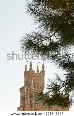 crimean pine tree and Swallow\'s Nest castle on Southern Coast of Crimea