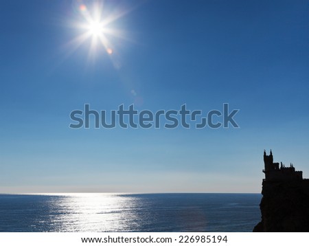 sun over Black Sea and Aurora cliff with Swallow Nest castle on South Coast of Crimea