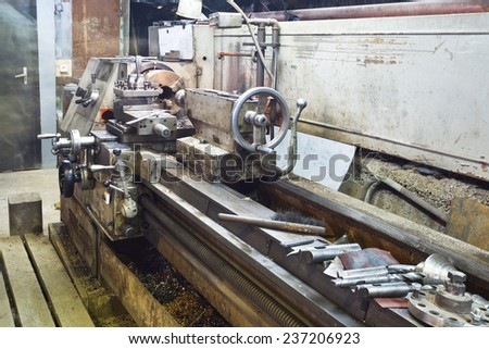 Center metal lathe machine in turnery workshop