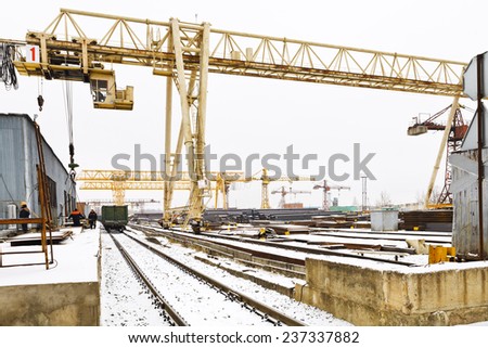 loading of metal rolling in railway carriage by bridge crane