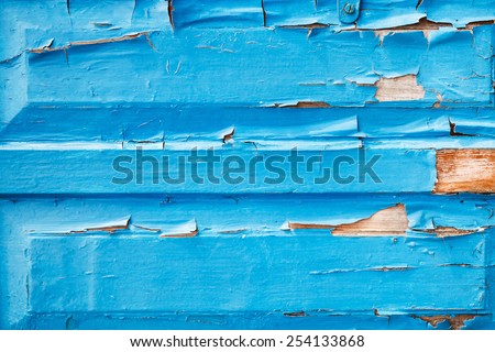 shabby blue wooden door panels close up