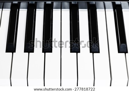 above view of black and white keys of digital piano close up