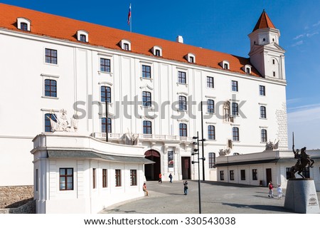 BRATISLAVA, SLOVAKIA - SEPTEMBER 23, 2015: Tourists at Honorary courtyard of Bratislava castle. Bratislava Castle is the main ancient castle of Bratislava, it stands directly above the Danube river