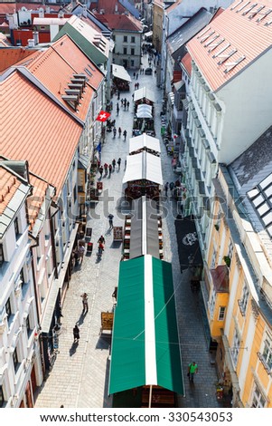 BRATISLAVA, SLOVAKIA - SEPTEMBER 23, 2015: Above view of Michalska street with restaurants and people in Bratislava. In Middle Ages this street was part of trade route linking Baltic Sea with Danube