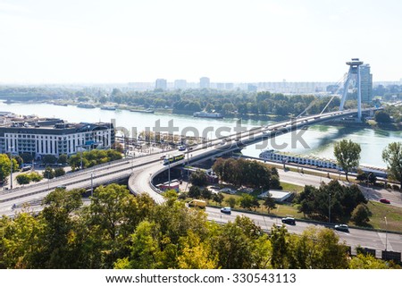 BRATISLAVA, SLOVAKIA - SEPTEMBER 23, 2015: View of Most SNP (Bridge of the Slovak National Uprising, Novy most, New Bridge) bridge and Danube river in Bratislava. The bridge was constructed in 1972