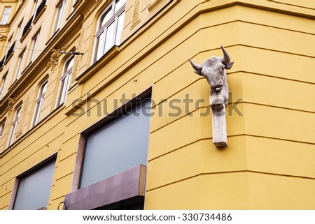 travel to Brno city - street sculpture on wall of apartment house in Brno old town, Czech
