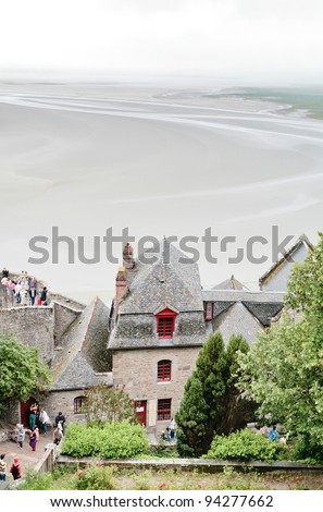 MONT SAINT-MICHEL, FRANCE - JULY 5: tidal sea bottom around Mont Saint-Michel. More than 3000000 people visit Saint Michael\'s Mount each year, in France on July 5, 2010.