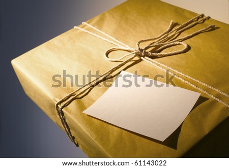 Brown parcel with string & blank note