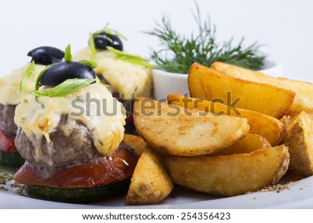 tasty dish of meat and potatoes is photographed close-up
