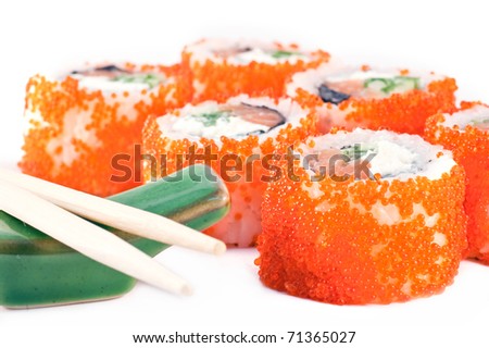 sushi with red caviar and the Chinese sticks close up.