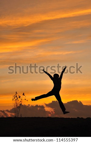 silhouette of friends jumping in sunset
