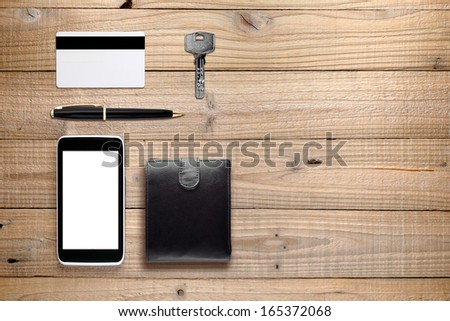 Everyday accessories and objects on wooden background