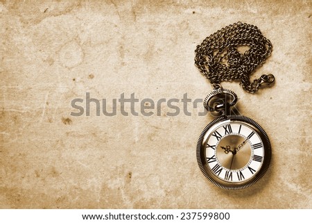 Vintage watch on old paper background