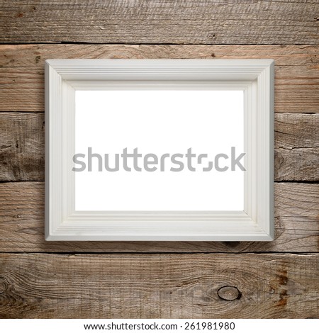 Picture frame on wooden wall