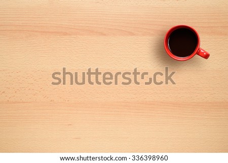 Coffee cup on office desk top view