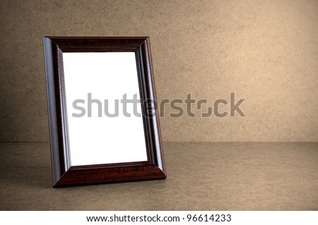 Old wooden photo frame on grunge background