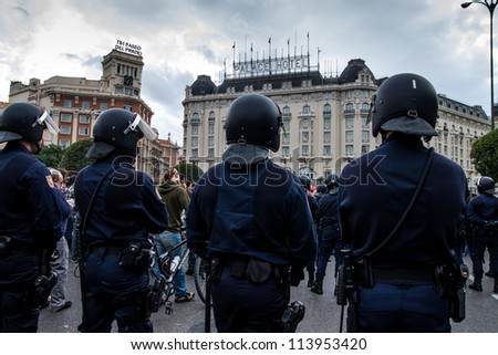 MADRID - SEPT. 25: Spanish Police by closing the street to the Congress building during the Protests in Spain against the Spanish economic crisis and political system in Madrid on Sep 25 2012