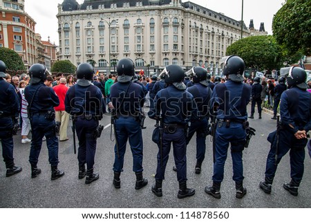MADRID - SEPT 25: Spanish Police by closing the street to the Congress building during the Protests in Spain against the spanish economic crisis and political system in Madrid on Sept 25 2012
