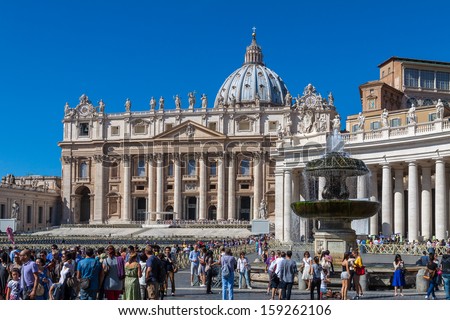 VATICAN CITY, VATICAN - SEP 20: Tourists at Saint Peter\'s Square, September 20, 2013 in Vatican City, Vatican.  Saint Peter\'s Square is among most popular pilgrimage sites for Catholics.