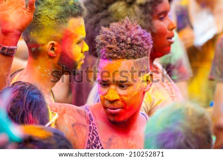 MADRID SPAIN -AUG 9: People celebrated Monsoon Holi Festival of Colors on August 9, 2014 in Madrid, Spain. People dancing and celebrating during the color throw.