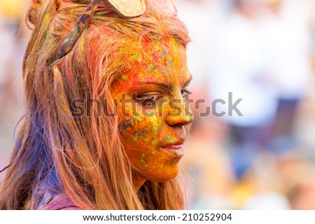 MADRID SPAIN -AUG 9: People celebrated Monsoon Holi Festival of Colors on August 9, 2014 in Madrid, Spain. People dancing and celebrating during the color throw.