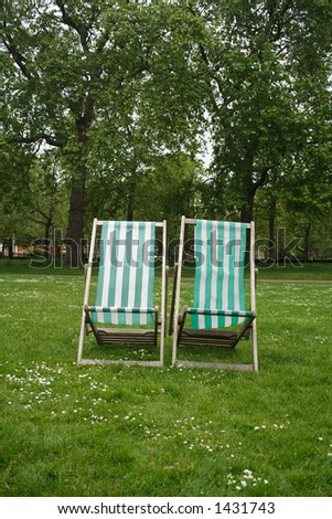 two deck chairs in a royal park