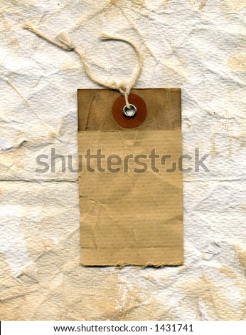 grunge shipping label. showing plenty of wear, stains and texture. on crumpled worn paper