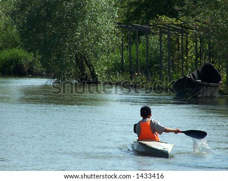 Child. Training of sports rowing on boats. City on Water. The city of Vilkovo. The Odessa region. Ukraine. Delta of the river Danube.