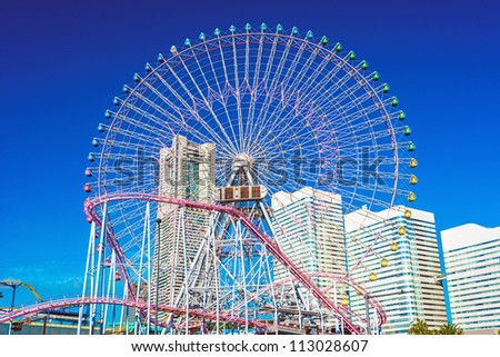A huge Ferris wheel and urban scene. in Yokohama City, Kanagawa, Japan.