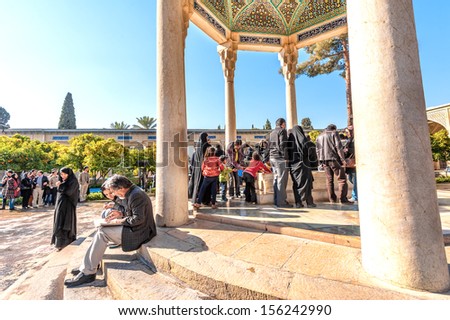 SHIRAZ, IRAN - DECEMBER 30: People visiting the tomb of poet Hafez in Shiraz, Iran on December 30, 2012. Hafez was the most famous poet in Iran.