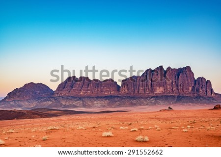 The Mountain of Wadi Rum in Jordan at the twilight hour. Wadi Rum is known as The Valley of the Moon and has led to its designation as a UNESCO World Heritage Site.