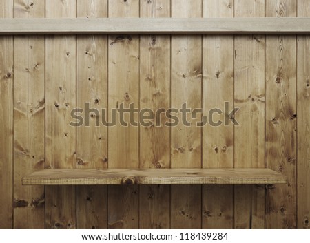 Empty wood shelf on wooden wall
