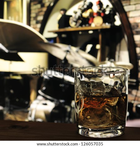 glass of whiskey on the table in jazz bar