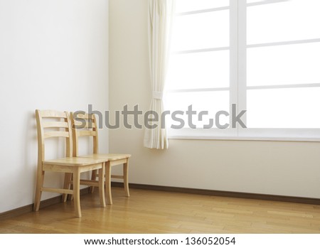 wooden chairs in simple room